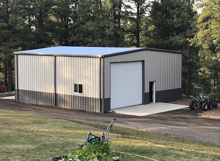 Metal frame garage workshop with corrugated steel
